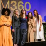 Foto de Carla Akotirene, Margareth Goldebenrg, Paola Carosella, Ana Paula Padrão e Mafoane Odara em cima do palco do evento.